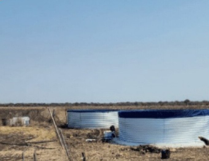 Two round water storage tanks